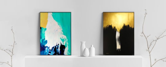 two gold abstract art paintings in home decor